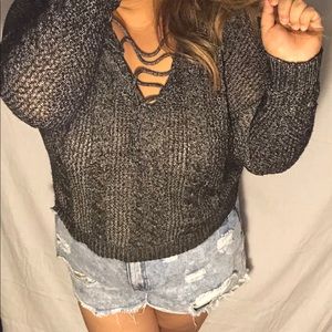Gray knit sweater with lace up front detail